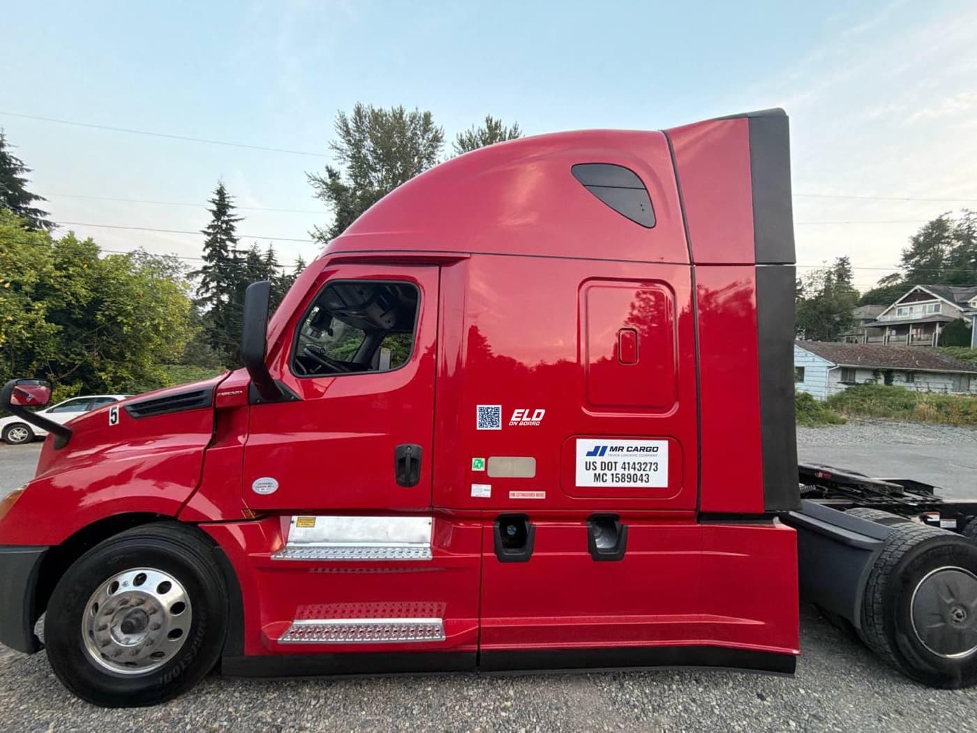 An MR Cargo tractor with its USDOT and MC numbers on the door